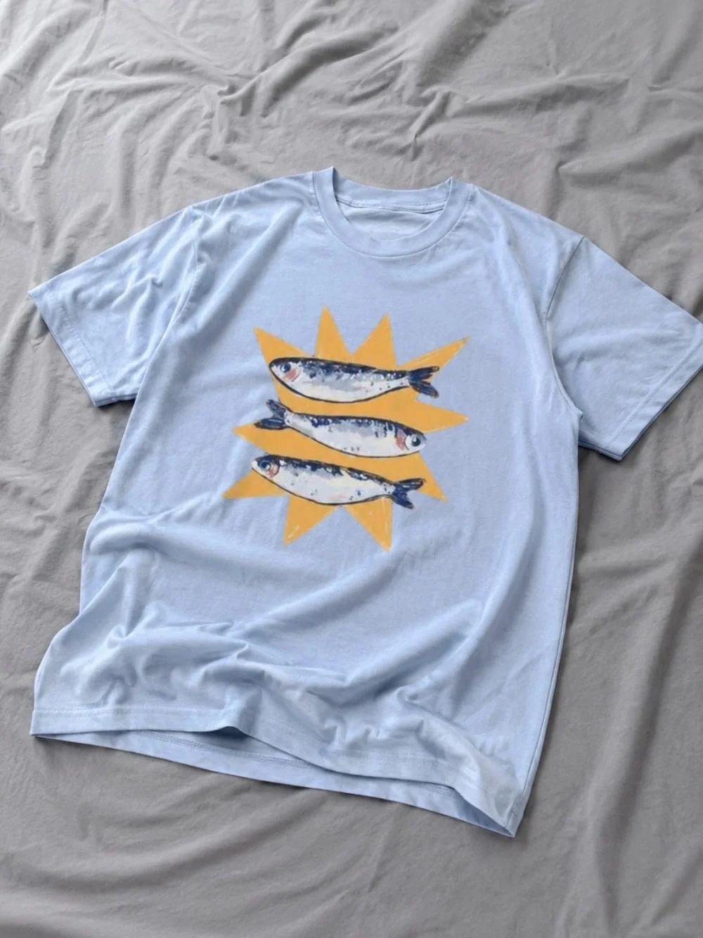 Gildan Light Blue Tee with Yellow Starburst and Fish Graphic